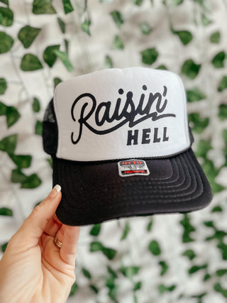 Black Raisin' Hell Trucker Hat-Ball Caps-The Lattimore Claim-Motis & Co Boutique, Women's Fashion Boutique in Carthage, Missouri